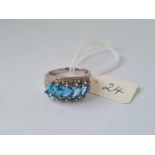 Unusual white 9k dress ring set with 5 blue baguette stones size P 5.8g