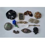 A quantity of assorted interesting brooches