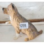 Royal Doulton terrier with paw outstretched. 5.5 in high
