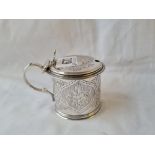 Engraved flower motive mustard pot with pierced thumb piece 1864 by W E. 103gms (No liner).