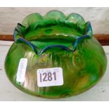 At Nouveau green lustre wavy edge rim.organic forms within the glass.6 in wide