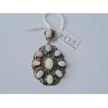 A quality antique silver Austro Hungarian pendant set with opal like stones