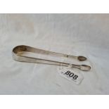 Pair George III sugar tongs with beaded edges by script G J . 36gms