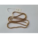 A fancy link neck chain in 9ct - 11gms