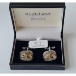 A cased pair of watch movements cufflinks