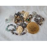 A bag of assorted costume jewellery