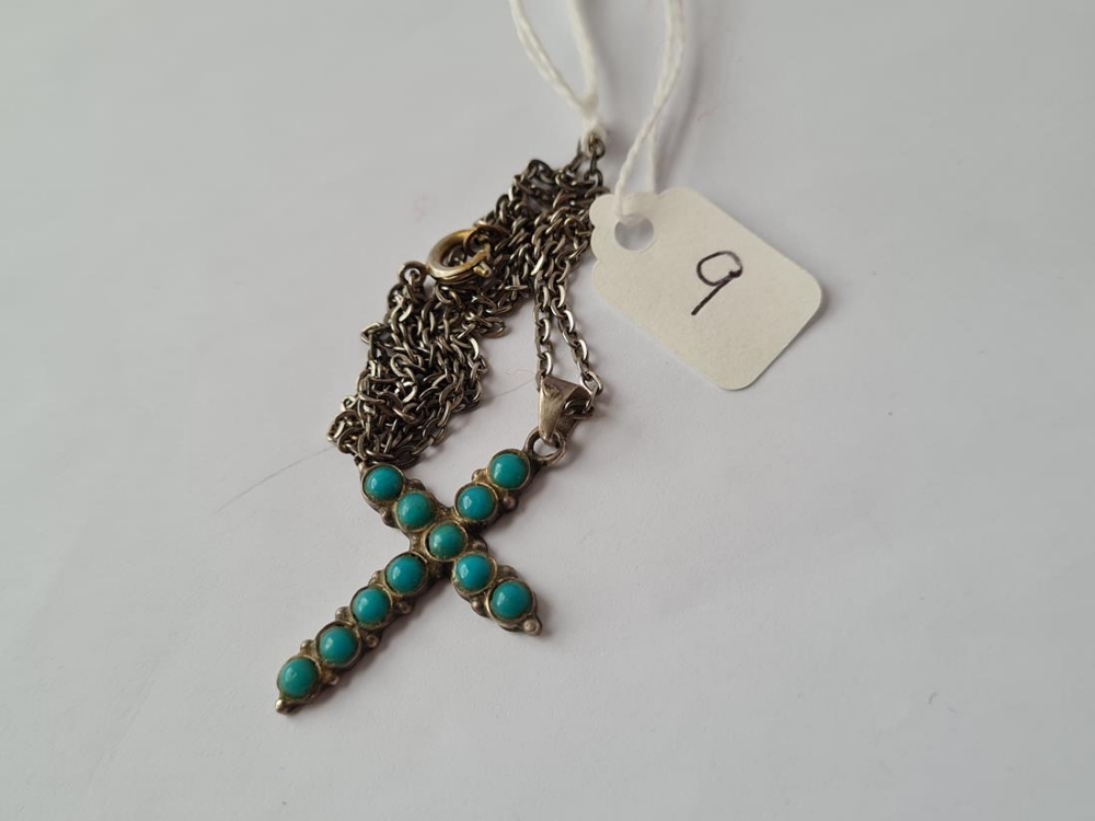 A silver & turquoise cross on chain