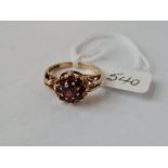 A garnet cluster ring set in 9ct - size P - 3gms