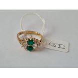 An emerald & diamond cluster ring in 9ct - size O - 3.1gms