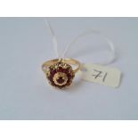 A fancy dome top garnet dress ring in 15ct mount size 3.4g inc