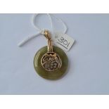 A green stone pendant in 9ct - 9.9gms