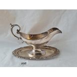 Oval sterling silver sauce boat screwed to a stand 9in long over handle 390 gms