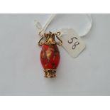 A red stone Urn charm in 9ct - 7.64gms