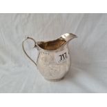 Heavy Georgian Style cream jug. Engraved with drapery 4 in high Birmingham 1912 . 157gms