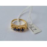 A diamond & sapphire ring in 14ct gold - size N - 3.4gms
