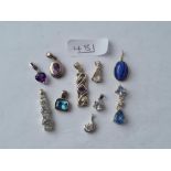 A bag of 10 small silver mounted stone pendants