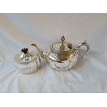 Oval half fluted tea caddy hinged cover and a BM teapot