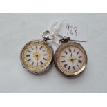 Two ladies clean silver fob watches