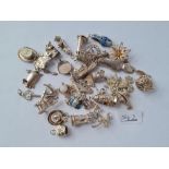 A quantity of silver charms - 88gms