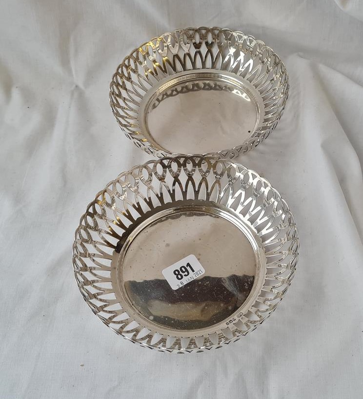 Good pair of heavy circular dishes with pierced sides. 7in diam. Sheffield 1912. 440gms.