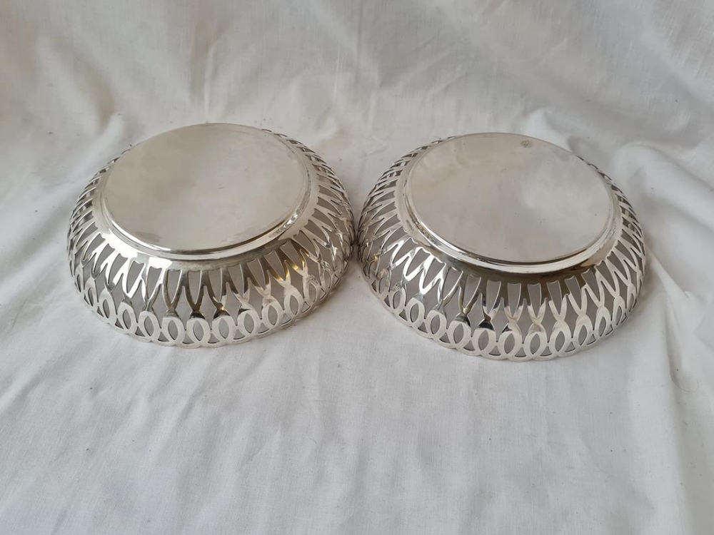 Good pair of heavy circular dishes with pierced sides. 7in diam. Sheffield 1912. 440gms. - Image 2 of 2