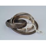 Four silver bangles