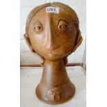 Stoneware figure of a head 12.5 in high