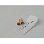 A pair of diamond ear studs set in gold