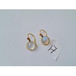 Pair circular moonstone and gold drop earrings