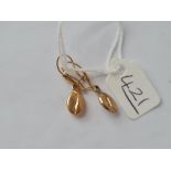 A pair of bean shaped earrings in 9ct