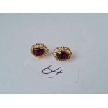 A pair red stone 9ct earrings