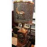 BEATEN COPPER TABLE LAMP & SHADE DEPICTING AN AFRICAN MASK & ANIMALS - NEED REWIRING BY QUALIFIED