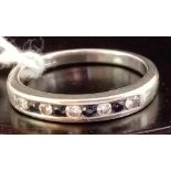 A 9 STONE DIAMOND & SAPPHIRE RING SET IN 9ct WHITE GOLD - SIZE 'P'