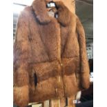 A FUR LADIES COAT - SIZE 12