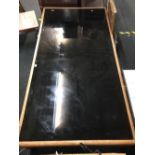 LARGE SMOKED GLASS COFFEE TABLE WITH WOOD WORM DAMAGE THAT HAS BEEN TREATED 6ft X 3ft APPROX