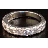 AN 11 STONE DIAMOND HALF ETERNITY RING IN WHITE GOLD - SIZE 'L'