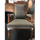 ANTIQUE UPHOLSTERED ARMCHAIR, CARVED TO BACK TURNED LEGS ON CASTERS