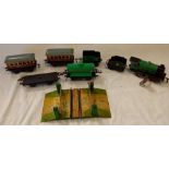 QTY OF TOY RAILWAY ITEMS INCL; WINDUP LOCOMOTIVE BY HORNBY,2 CARRIAGES, OIL REFINERY TRUCK & LEVEL