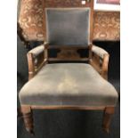 ANTIQUE MAHOGANY UPHOLSTERED CARVED ARMCHAIR, TURNED LEGS & CASTERS