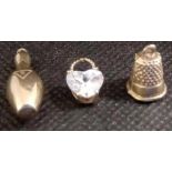 A 9ct BELL SHAPED CHARM, A TEN PIN BOWLING PIN & ANOTHER