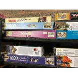 2 SHELVES OF JIGSAW PUZZLES