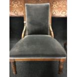 ANTIQUE CARVED MAHOGANY UPHOLSTERED CHAIR, TURNED LEGS ON CASTERS