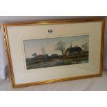 19THC WATERCOLOUR OF A FIGURE ON THE ROAD BESIDE THATCHED COTTAGES. SIGNED HART