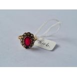 A garnet & pearl ring in 9ct - size J - 3.3gms