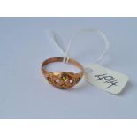 A peridot and 9ct rose gold ring (stones missing) size S
