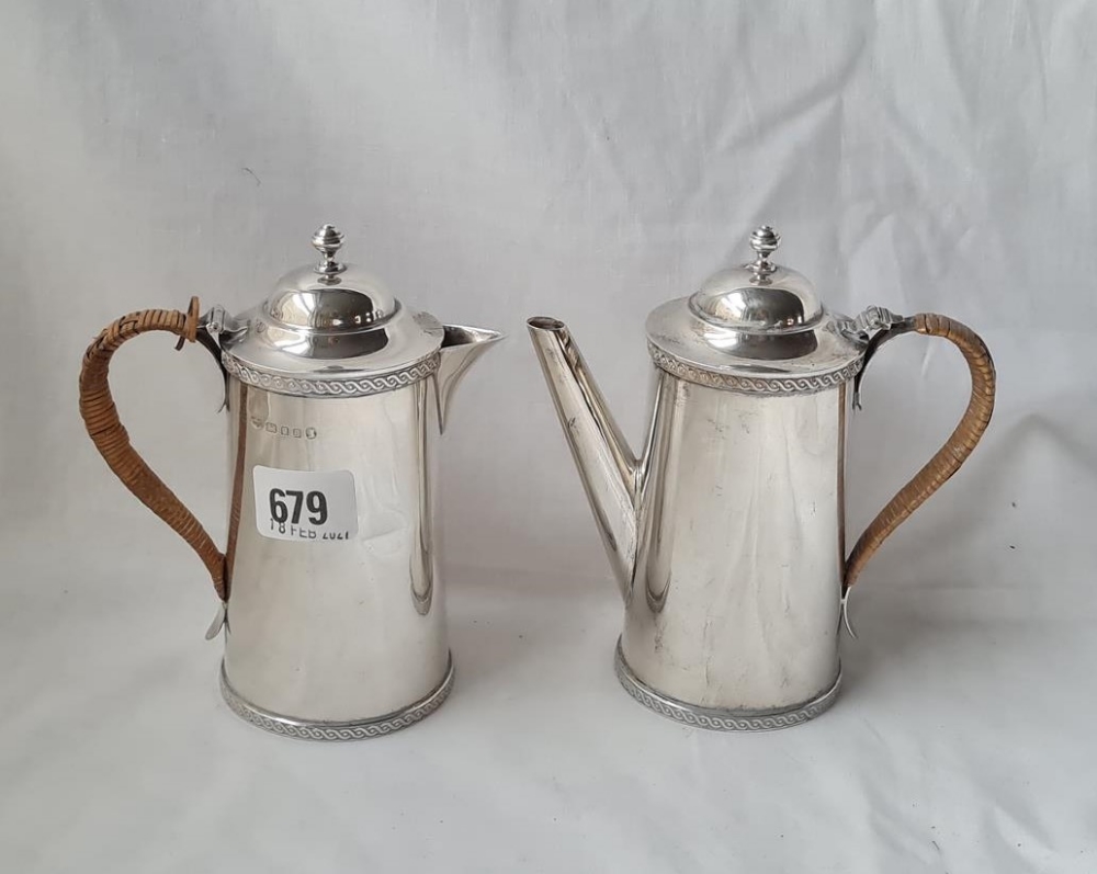 A pair of coffee au lait jugs with decorated rims hight 6 inches London 1935 585 gms
