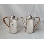 A pair of coffee au lait jugs with decorated rims hight 6 inches London 1935 585 gms