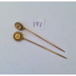 Two 15ct gold top stick pins one diamond set