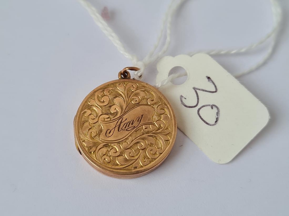 A circular 9ct back and front locket