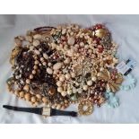 A bag of assorted costume jewellery - 1200gms